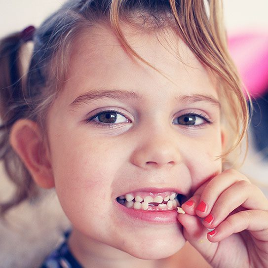 Planning for Your Child's First Loose Tooth - Pure Gold Professionals in Dentistry - Redlands Dentist - Pure Gold Professionals in Dentistry - Redlands Dentist -